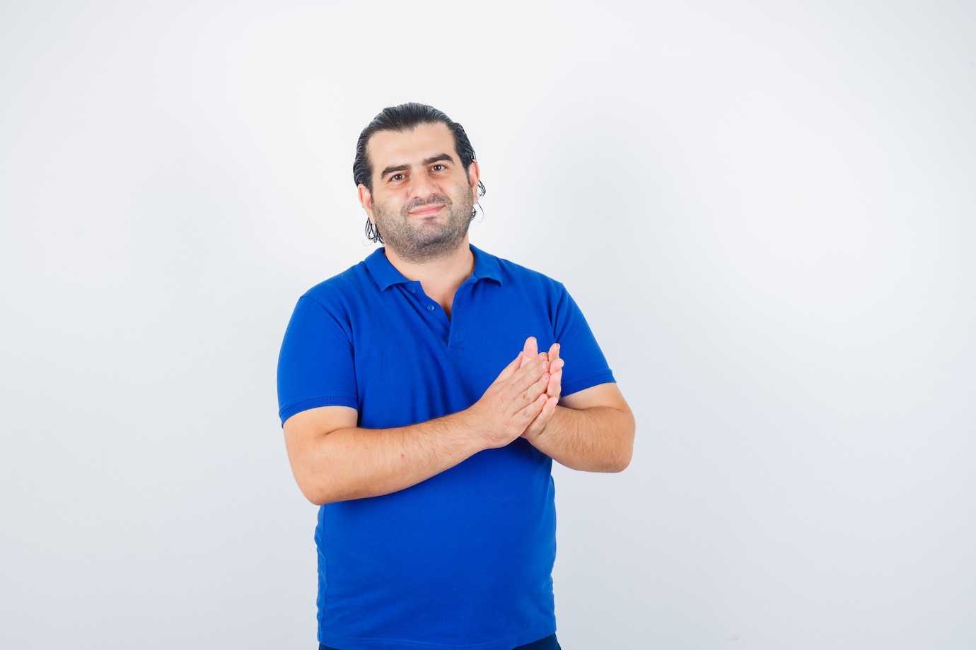 middle-aged-man-applauding-blue-t-shirt-looking-happy_176474-61526